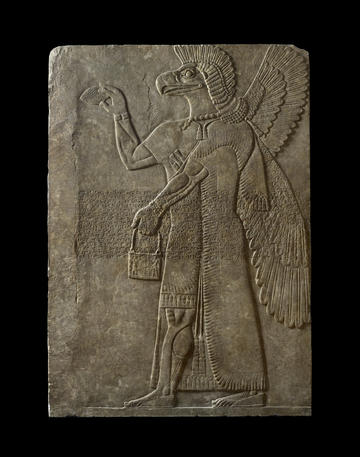 Photograph of an Assyrian relief of a winged genius