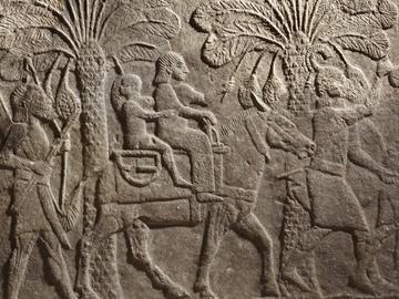 Detail of an Assyrian relief depicting women and children captives escorted by soldiers